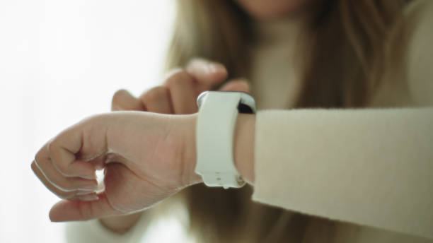 istock Woman talking with voice assistant on smartwatch. 2177393595