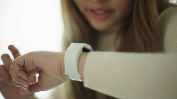 istock Woman talking with voice assistant on smartwatch. 2177393607