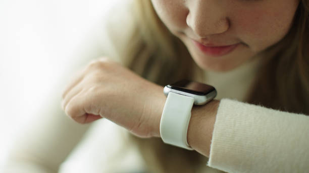 istock Woman talking with voice assistant on smartwatch. 2177393611