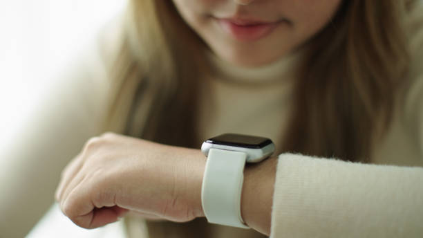 istock Woman talking with voice assistant on smartwatch. 2177393625