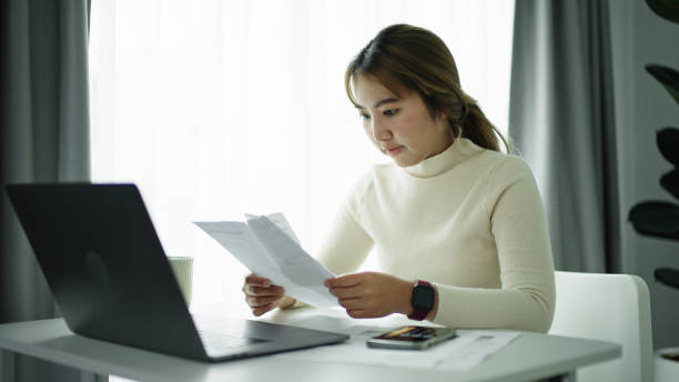 istock Businesswoman calculate bill. 2177393680