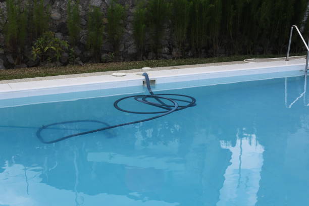 istock swimming pool and cleaning hose 2177394076