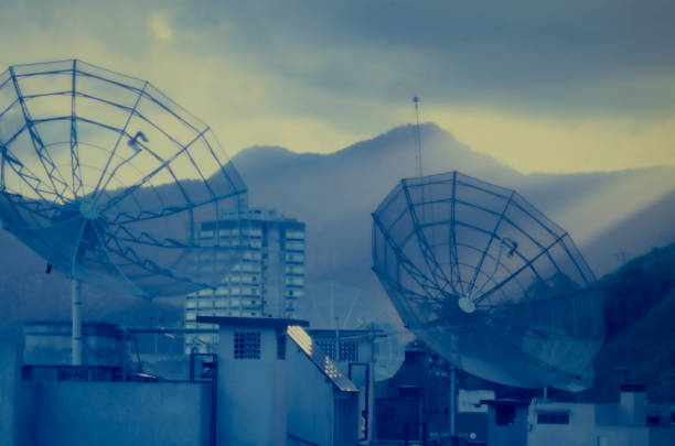 Satellite dishes between buildings in the city.
