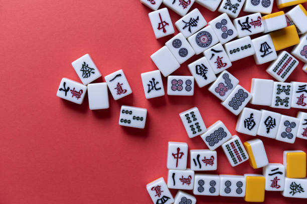 istock Mahjong tiles background on red background 2177394877