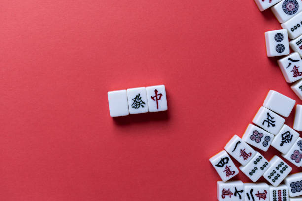 istock Mahjong tiles background on red background 2177394911