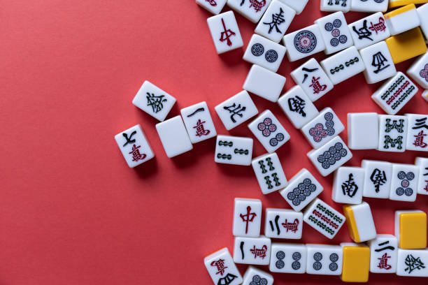 istock Mahjong tiles background on red background 2177394933