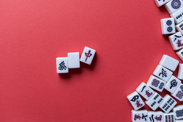 istock Mahjong tiles background on red background 2177394944