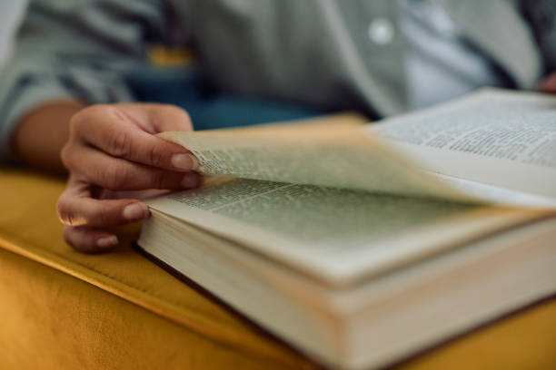 istock Close up of woman reading book. 2177400600