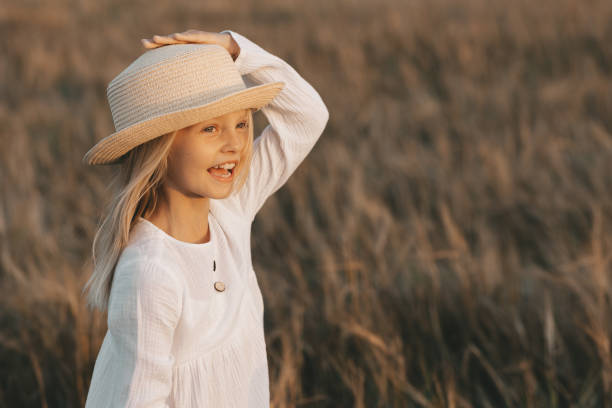 kids walking at sunset in rye, happy child, field of rye