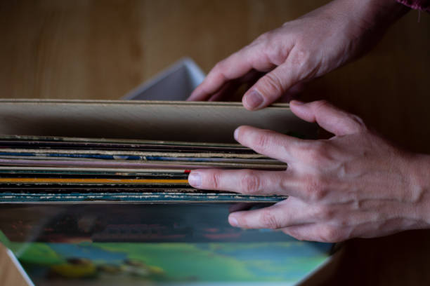 istock Close-up of woman's hands, searching a vinyl record 2177408167
