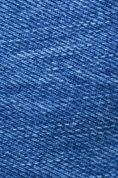 Close-up of a Blue Denim Jeans Pocket with Rivets and Stitching Details for Fashion and Textile Design