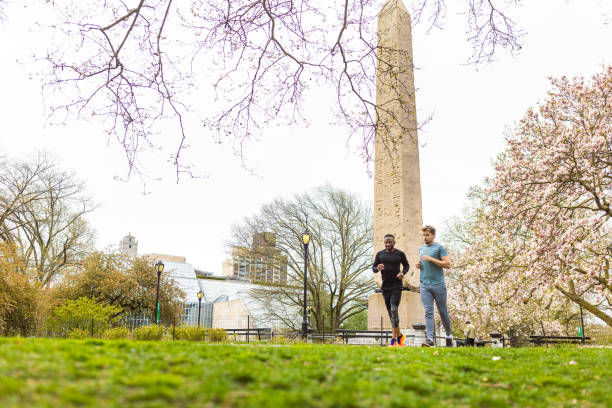 Morning Jog in Urban Park with Monument. Central Park, NYC