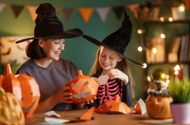 istock Happy family preparing for Halloween. 2177410901