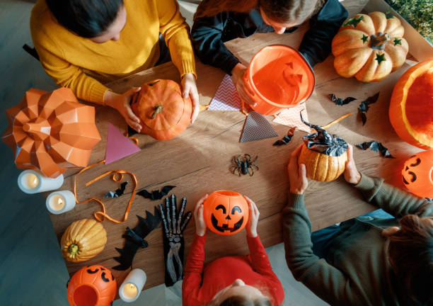 istock Happy family preparing for Halloween. 2177411876