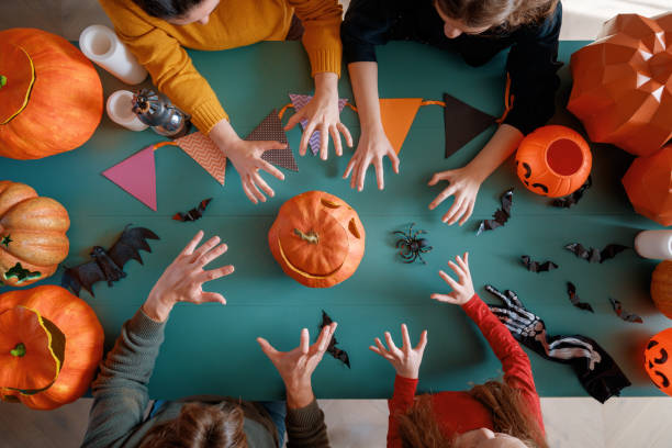 istock Happy family preparing for Halloween. 2177411912