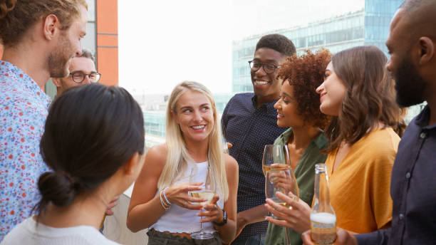 istock Multi-Cultural Business Team Meeting Outdoors For After Work Drinks On Office Rooftop Or Bar 2177413723