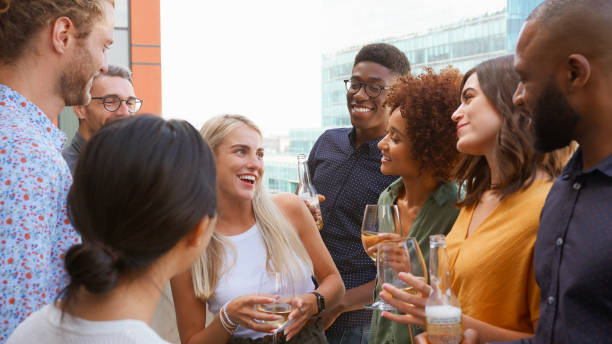 istock Multi-Cultural Business Team Meeting Outdoors For After Work Drinks On Office Rooftop Or Bar 2177413756