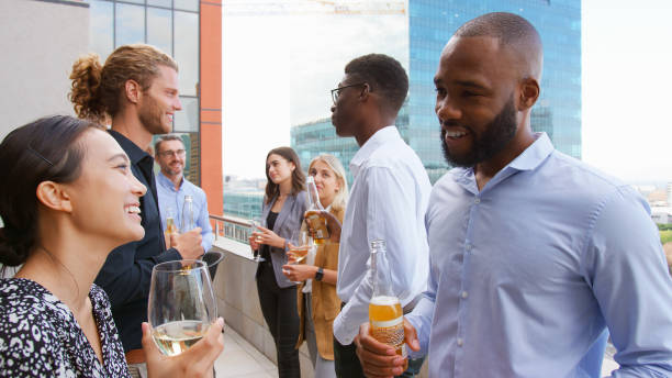 istock Multi-Cultural Business Team Meeting Outdoors For After Work Drinks On Office Rooftop Or Bar 2177414966