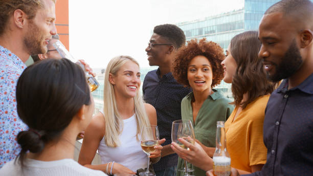 istock Multi-Cultural Business Team Meeting Outdoors For After Work Drinks On Office Rooftop Or Bar 2177415221