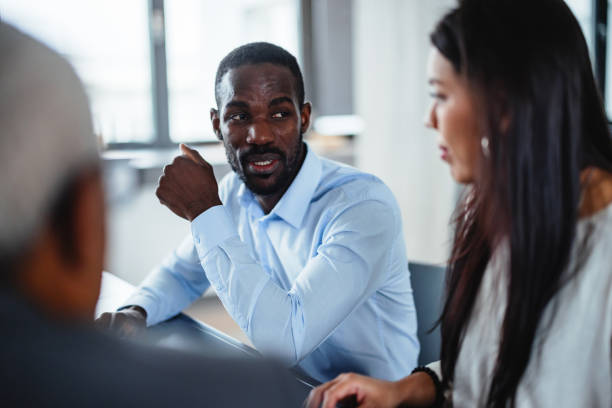 istock Black and Latin Business Professionals in Discussion 2177416072