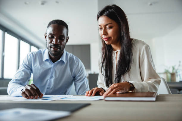 istock Black and Latin Business Professionals Collaborating at Work 2177416116