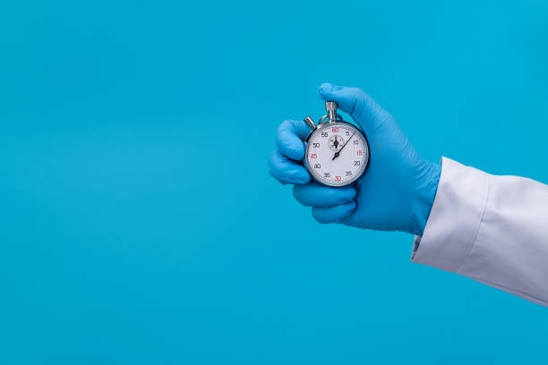 istock Doctor hand holding a stopwatch 2177418084