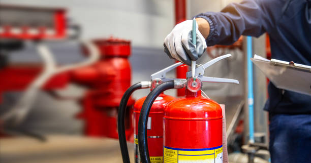 istock Engineer are checking and inspection a fire extinguishers tank in the fire control room for safety training and fire prevention. 2177418880