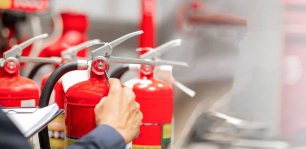 istock Engineer are checking and inspection a fire extinguishers tank in the fire control room for safety training and fire prevention. 2177419039