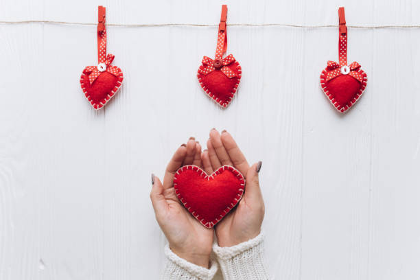 istock Female hands holding decorative heart for valentine's day. 2177419346