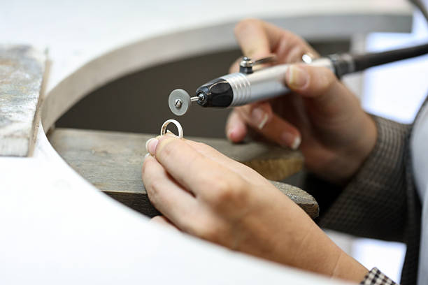 istock Jeweler polishing a ring 2177421455