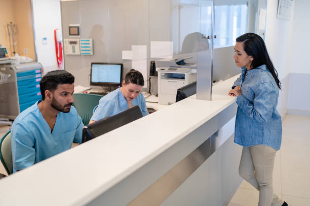 istock Pregnant patient at hospital reception desk 2177423615