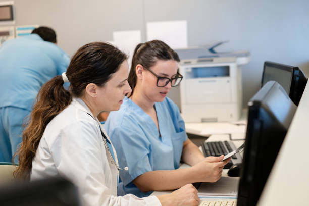 istock Hospital staff discussing information on computer monitor 2177425162