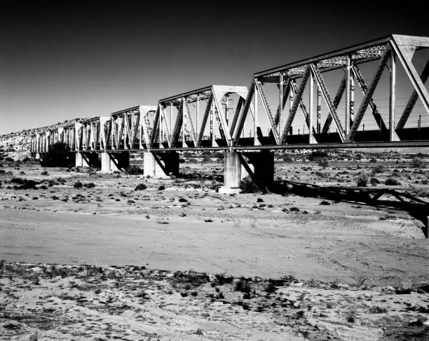 Film image Railroad bridge Dry Gila river bed Sonora desert in central Arizona USA