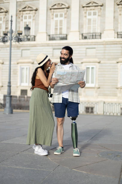 istock Smiling couple consulting city map on vacation 2177426332