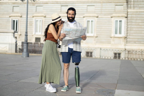 istock Happy couple consulting a city map while sightseeing 2177426353