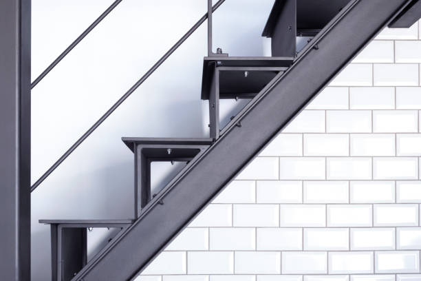 The Modern Staircase Design Incorporates Both Metal and Tile Accents to Create Unique Visuals