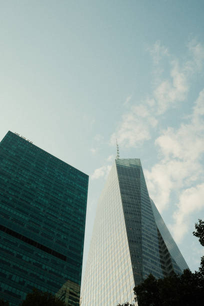 istock Modern skyscrapers reaching for the sky on a cloudy day 2177426538