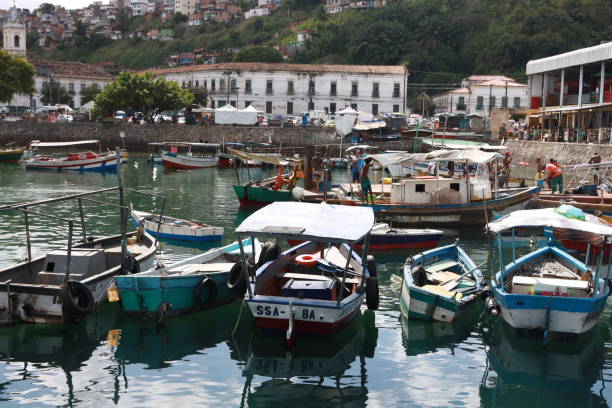 salvador, bahia, brazil - september 25, 2024: view of a fishing boat port next to the Sao Joaquim Fair in the city of Salvador.