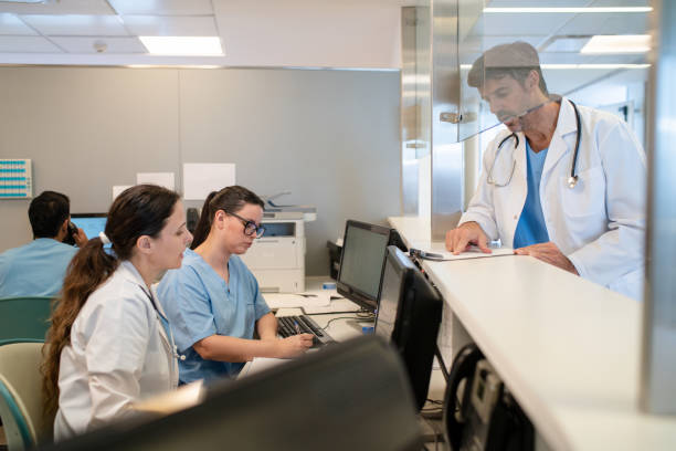 istock Doctor engaging with front desk staff in modern hospital 2177429174