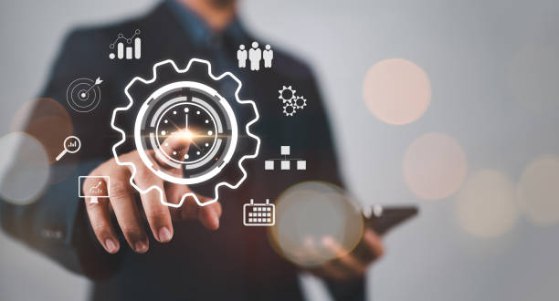 istock Time management concept. Businessman touching clock icon on virtual to work planning for increases efficiency and reduces work time. Business project planning. 2177432678