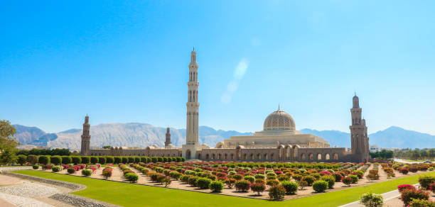 istock Sultan Qaboos Mosque stands majestically against the backdrop of Oman's mountains enveloped by vibrant gardens on a clear sunny day 2177433085