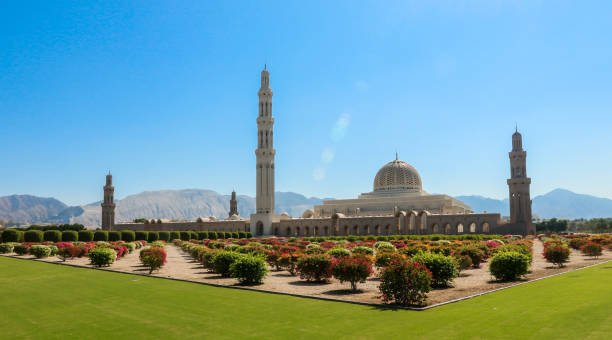 istock Sultan Qaboos Mosque in Oman surrounded by lush gardens under a clear blue sky during midday 2177433118