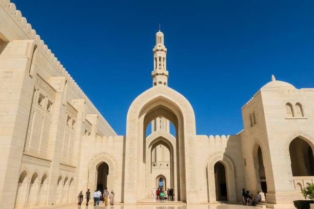 istock Visitors exploring the stunning Sultan Qaboos Mosque in Muscat Oman under a clear blue sky during the day 2177433335