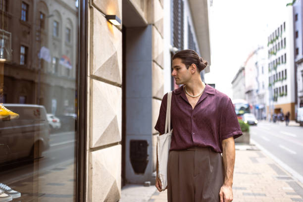 istock City Shopper Admiring Storefront 2177433341