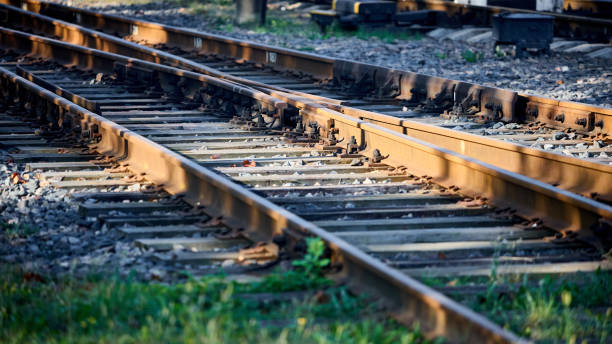 istock Large empty railroad crossing without fork. Concept of industrial logistic and transportation background with selective focus on intersection with copy space 16x9. 2177435146