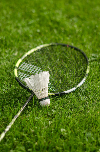 istock Badminton racket and shuttlecock on grass background 2177441209