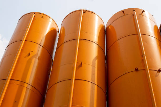 High iron yellow tanks silons in concrete production. Industrial constructions.