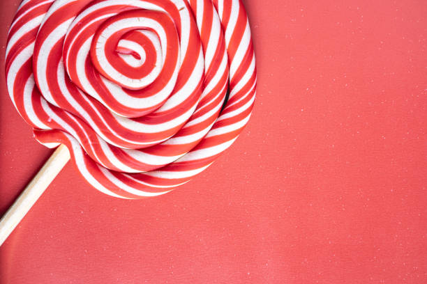 Christmas lollipops on a grey background. Christmas candy. Background for Christmas related things.