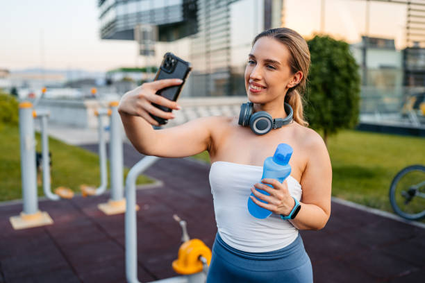 istock Young Woman Taking Selfies Before A Workout Outdoors 2177448293