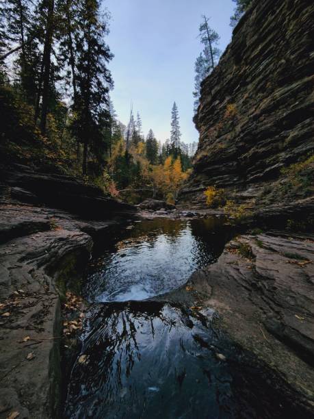 istock Moody Autumn Waterfall in Forested Rock Canyon 2177449250